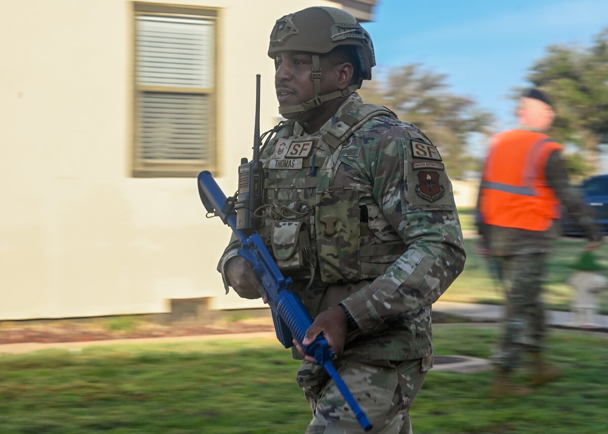U.S. Air Force Senior Master Sgt. Jarmaine Thomas, 17th Security Forces Squadron operations superintendent, moves to hold security during an exercise at Goodfellow Air Force Base, Texas, Nov. 16, 2023. Exercises are pivotal in aligning all of our groups on Goodfellow to respond to disasters as a unified command. (U.S. Air Force photo by Airman 1st Class Zach Heimbuch)