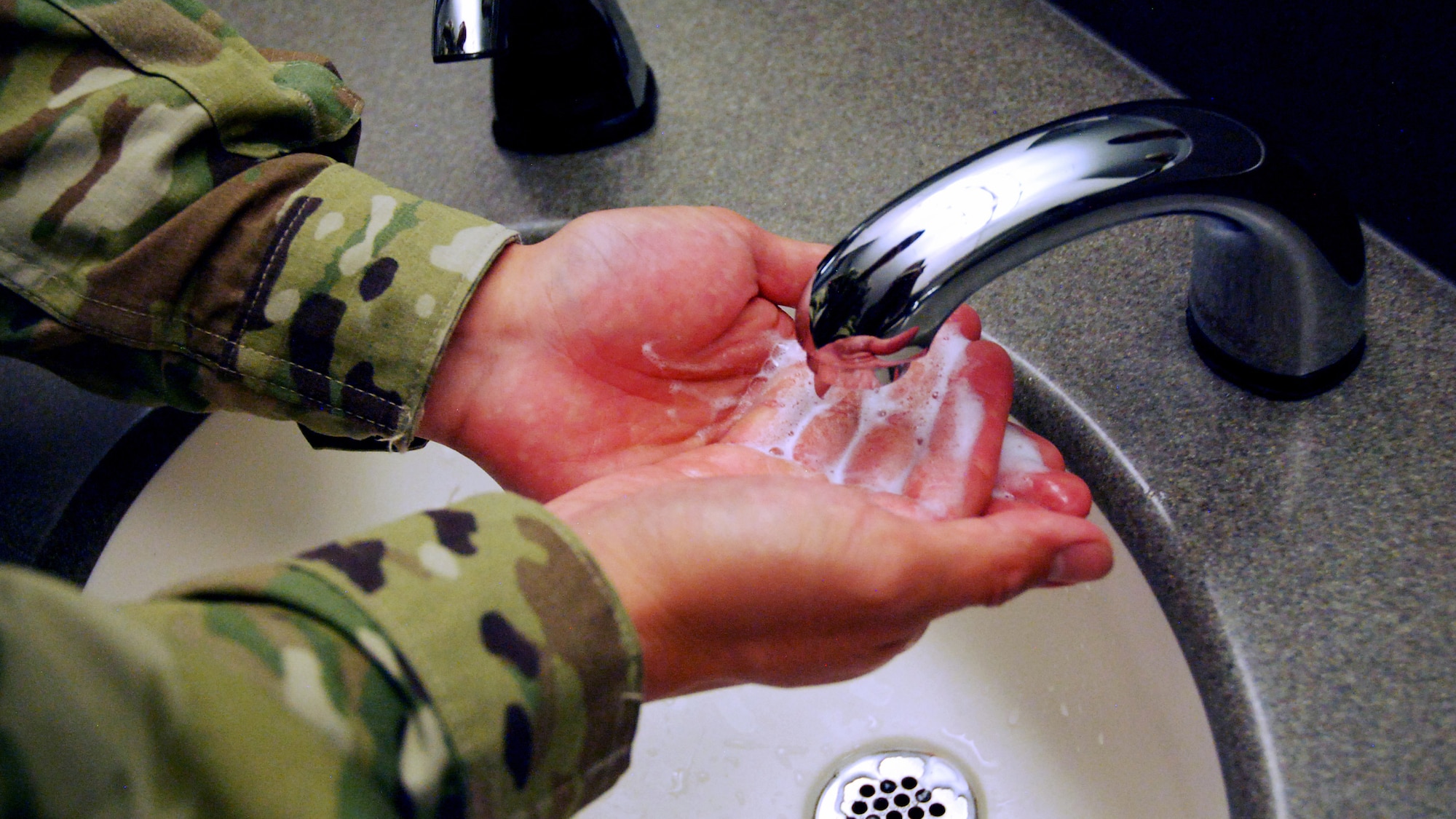 person washing hands