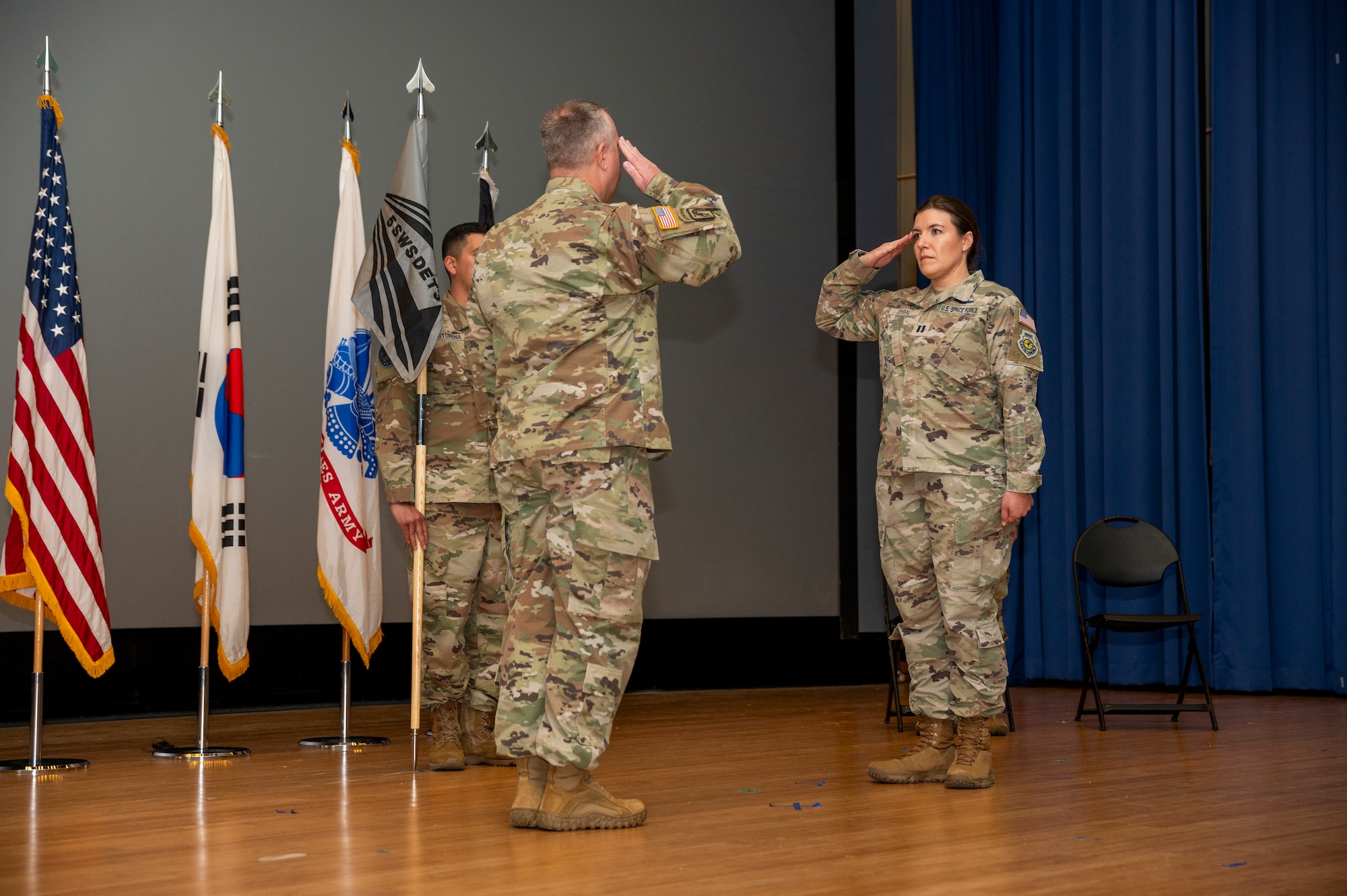 U.S. Army Lt. Col. Jason McCune, 1st Space Battalion commander, gives permission to U.S. Space Force Capt. April Dybal, 5th Space Warning Squadron Detachment 3 commander, to accept the missile warning mission of the 21st Space Company, 1st Space Battalion at Osan Air Base, Republic of Korea, Oct. 27, 2023.