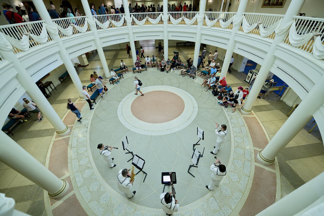 A view from above of a group of musicians playing in front of an audience.