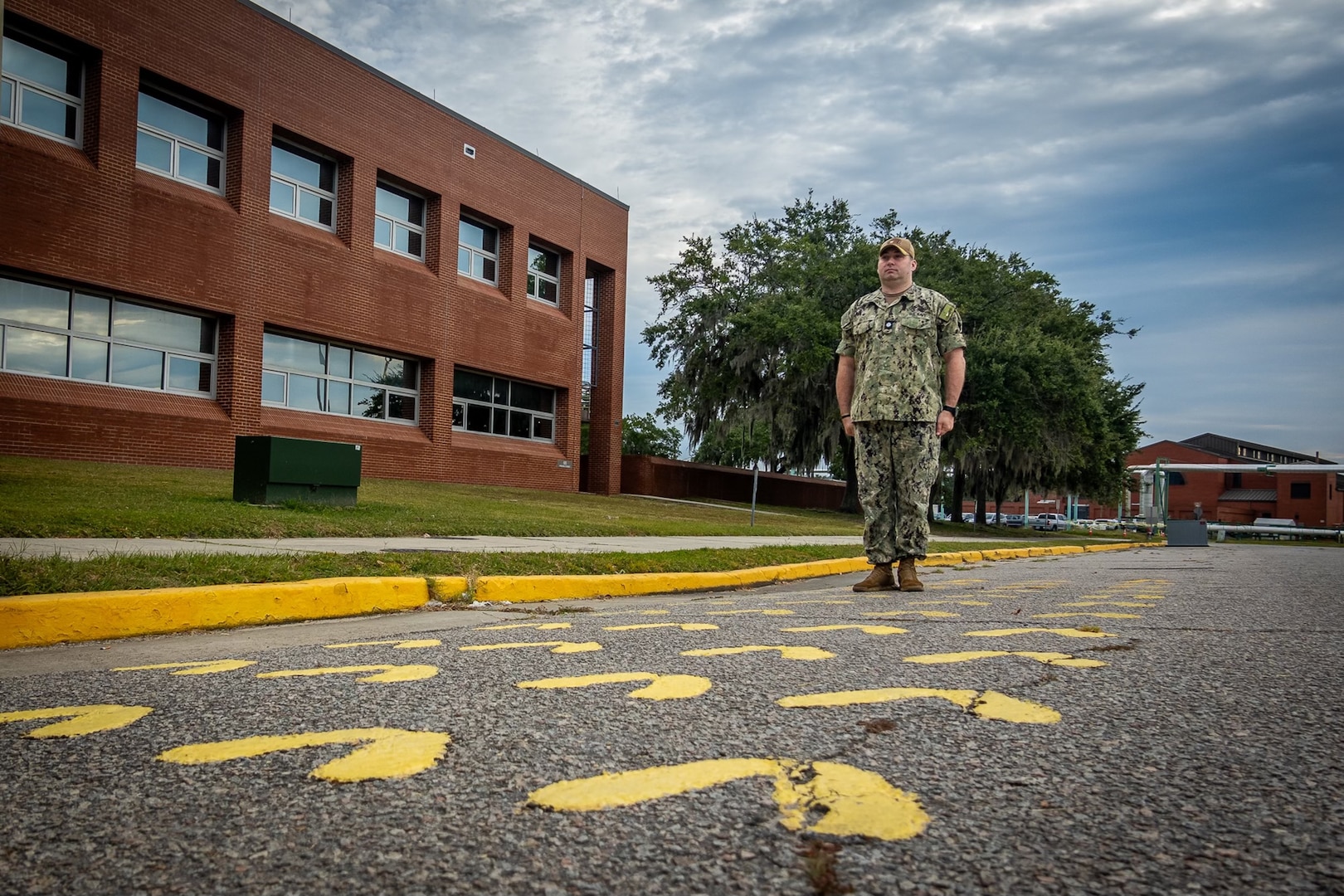 Navy Cmdr. Richard Yates, USMEPCOM 10th BN commander, stands on the same yellow footprints he stood on at his own reception during a Leaders Professional Development event. The Leaders Professional Development event was held 10 - 13 Oct. at Marine Corps Recruit Depot, Parris Island, South Carolina.