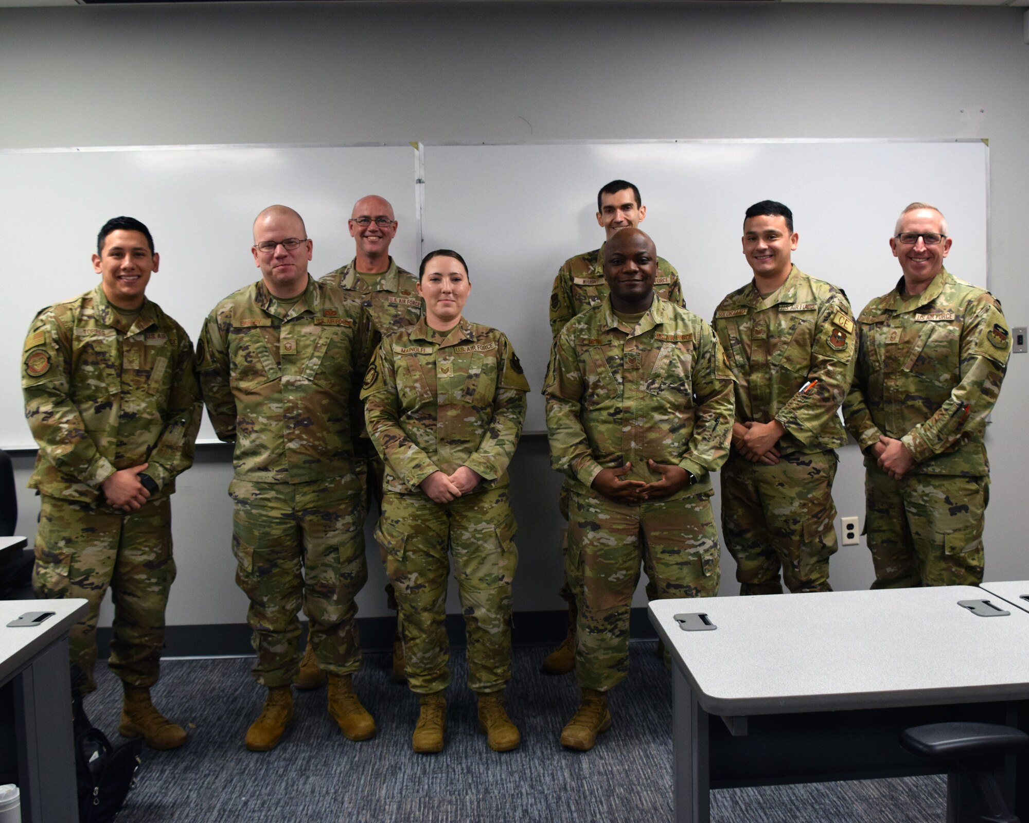 The Air Force Institute of Technology hosted three enlisted faculty members from the United States Air Force Academy on 17 October. The goal of the visit was to educate current AFIT enlisted master’s students about opportunities to teach at the Academy.  Front row: Staff Sgt. Steven Torres, AFIT master’s student, Master Sgt. James Earley, USAFA instructor, Technical Sgt. Lauren Mainolfi, AFIT master’s student, Technical Sgt. Nana Hene, AFIT master’s student, Technical Sgt. Jesse Solorzano, AFIT master’s student, and Chief Master Sgt. William Baez, USAFA assistant professor. Back row: Chief Master Sgt. Michael Deiderich, USAFA instructor and Technical Sgt. Mason Wright, AFIT master’s student. (U.S. Air Force photo by Katie Scott)