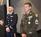 First Lieutenant Justin Nebelkopf and Sergeant First Class Wiliam Haverkamp of the Louisville Recruiting Company watch the activities held during a Veteran's Day Recognition event held at Corydon Middle and High School in Corydon, Indiana.