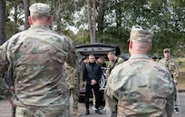 Joint Base Charleston leadership greet Ukrainian defenders as they emerge from a vehicle