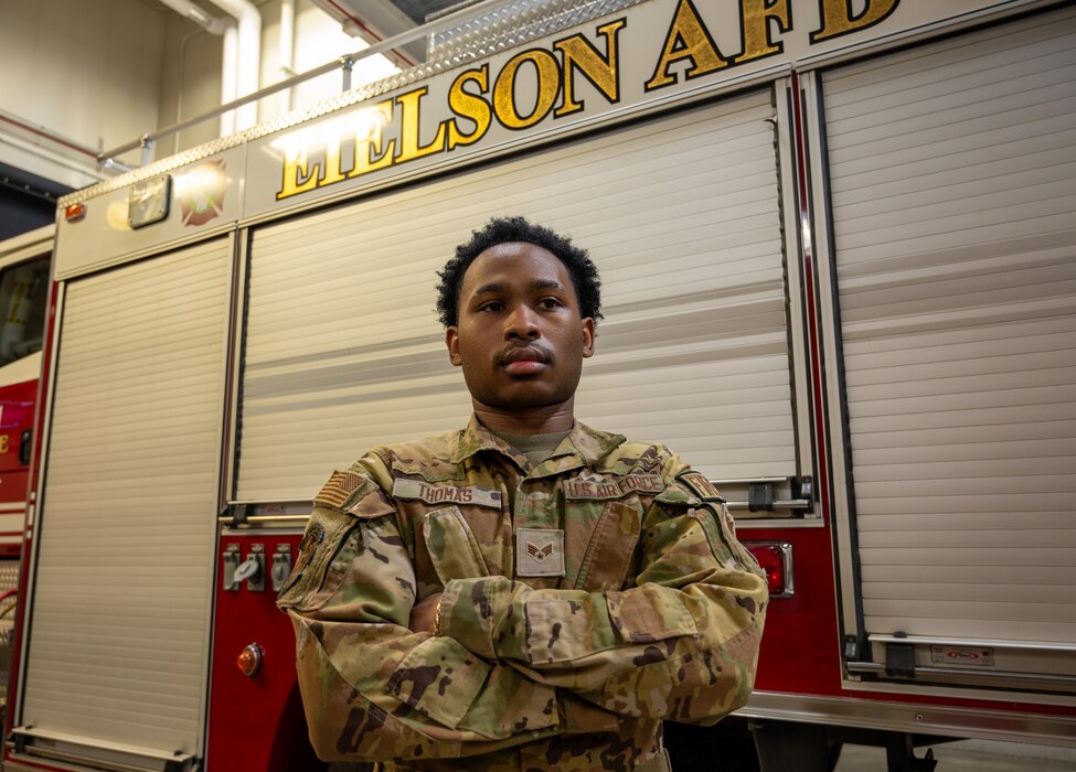 U.S. Air Force Senior Airman Desmond Thomas, 354th Civil Engineering Squadron fire and emergency services dispatcher poses for a photo November 7, 2023 at Fire Station 1 Eielson Air Force Base, Alaska.