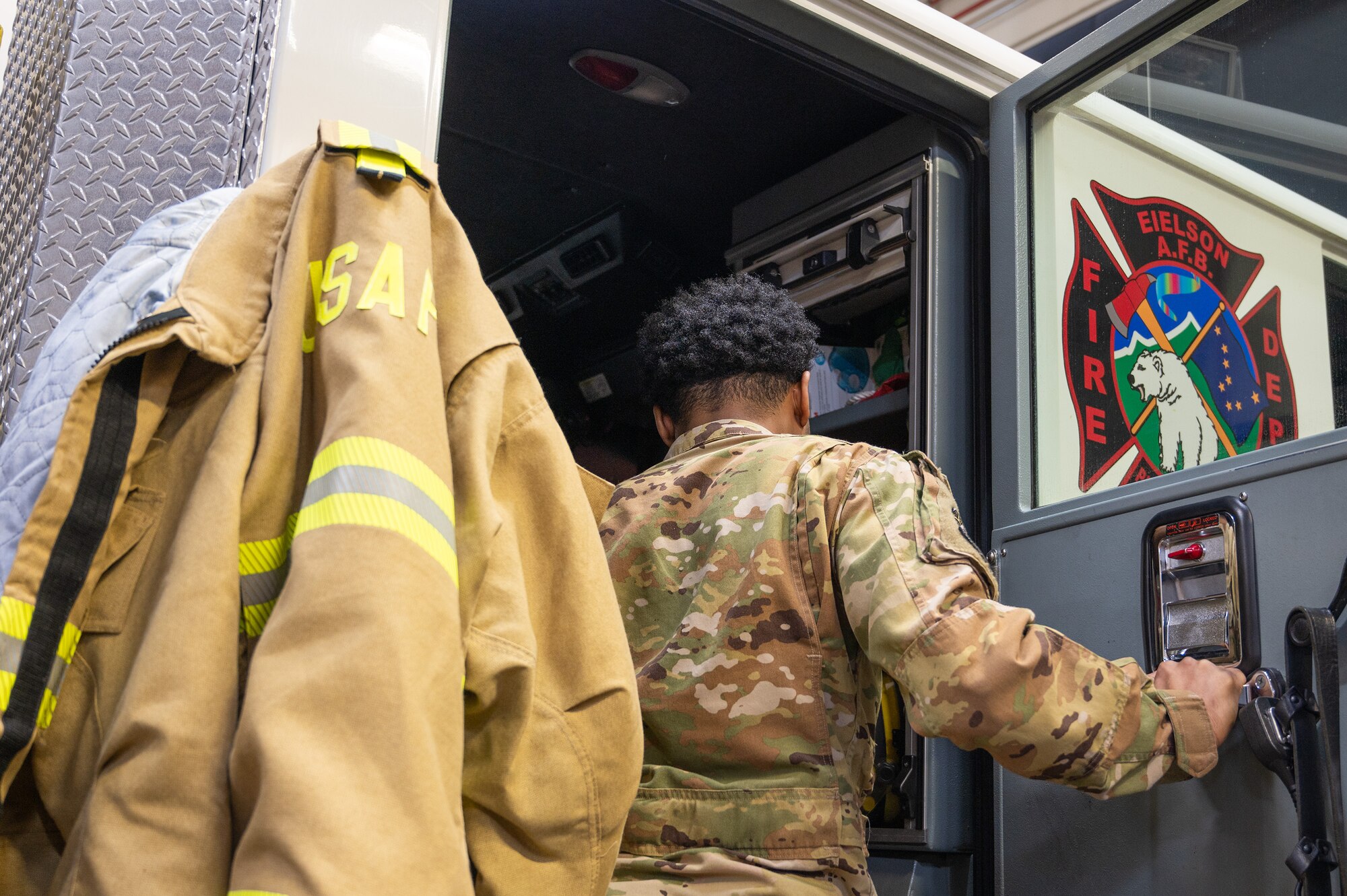 U.S. Air Force Senior Airman Desmond Thomas, 354th Civil Engineering Squadron fire and emergency services dispatcher poses for a photo November 7, 2023 at Fire Station 1 Eielson Air Force Base, Alaska.