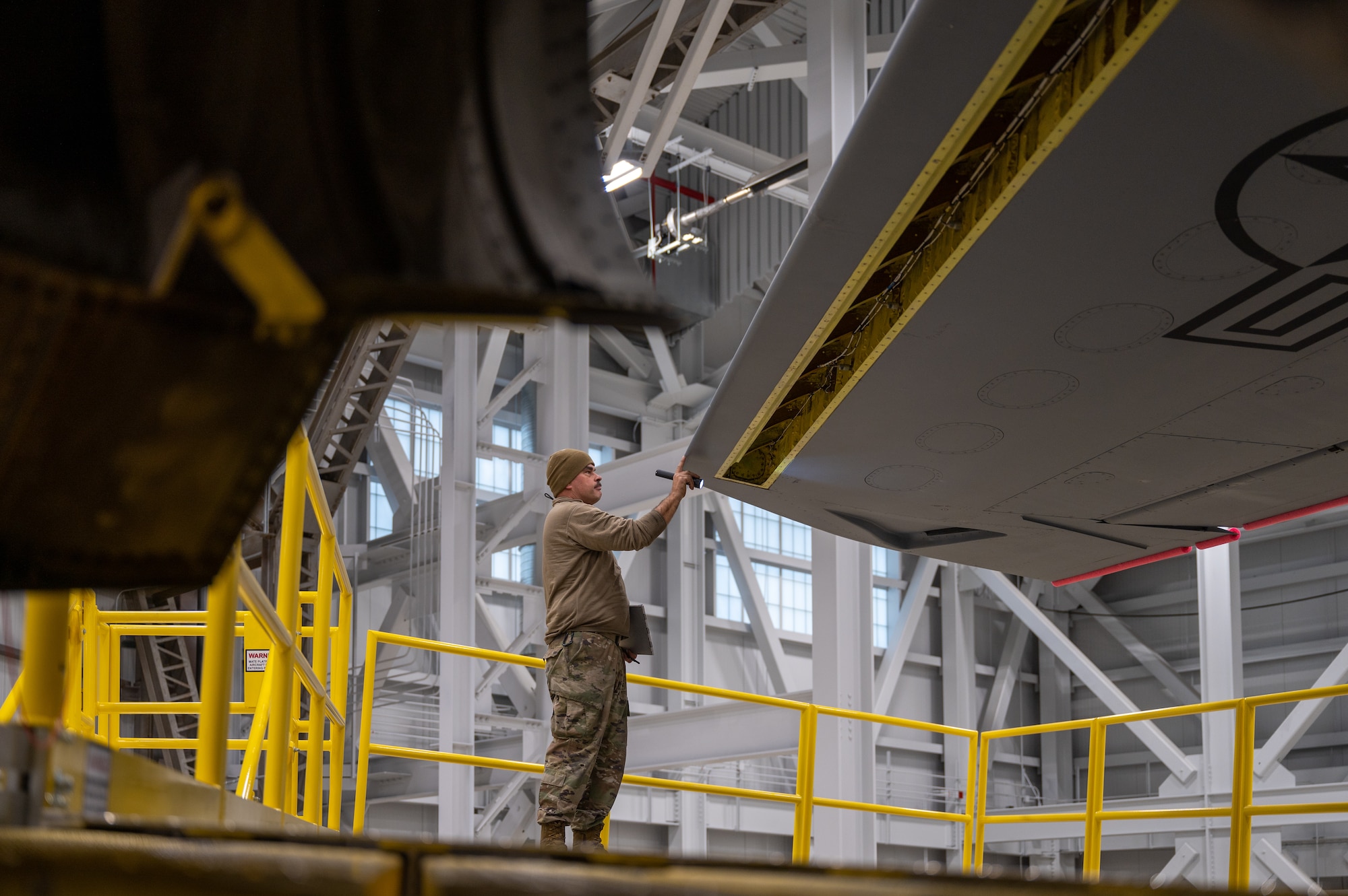 Senior Airman Richard Aikman, 434th Maintenance Squadron aircraft maintenance technician, inspects a KC-135R Stratotanker wing’s leading edge during a periodic inspection at Grissom Air Reserve Base, Ind., Nov. 8, 2023