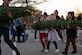 Capitol Christmas Tree event attendees carry a donated Christmas tree at Joint Base Andrews, Md., Nov. 16, 2023. During the event, military families received Christmas trees from Monongahela National Forest, the same forest as the Capitol Christmas Tree. (U.S. Air Force photo by Airman 1st Class Gianluca Ciccopiedi)