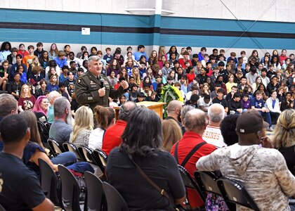 Soldier talking to students.