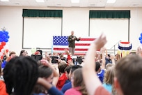 Soldier talking to students.
