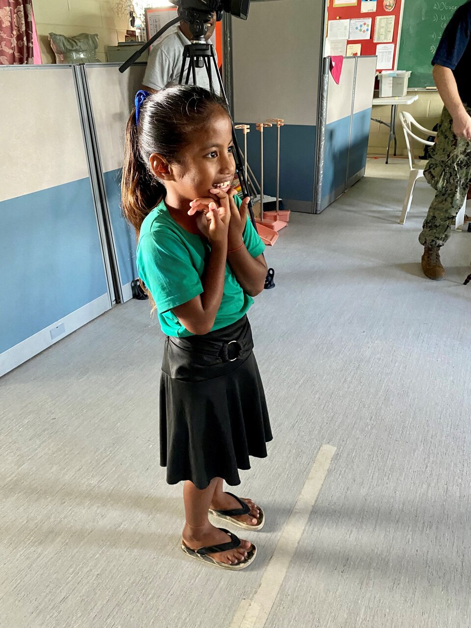 A young Ebeye Elementary School student recites the letters of the eye chart during her initial vision screening before receiving her first pair of glasses.