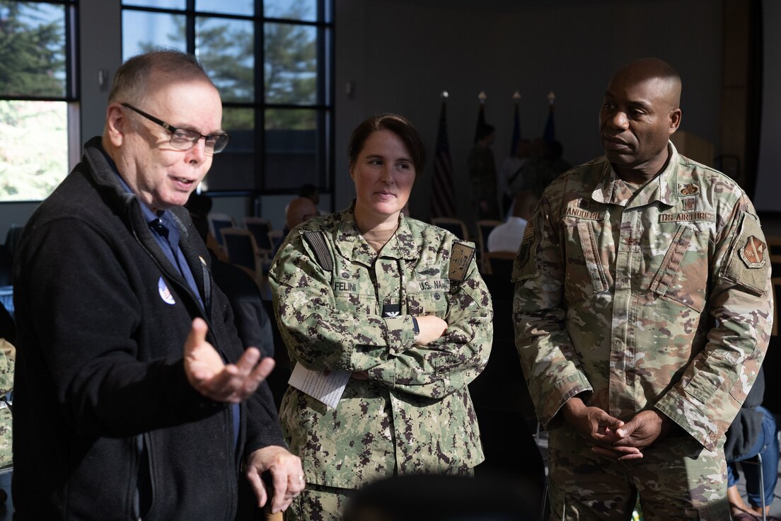 From left, retired U.S. Navy Rear Adm. Samuel J. Cox, Naval History and Heritage Command director, U.S. Navy Capt. Page Felini, Naval Air Facility Washington commanding officer, and Col. Todd E. Randolph, 316th Wing and installation commander, attend a Native American Heritage Month event at Joint Base Andrews, Md., Nov. 14, 2023. Cox was also the guest speaker at the event. (U.S. Air Force photo by Airman 1st Class Gianluca Ciccopiedi)