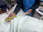 A member of the Family Birthing Center demonstrates the Jada® system.