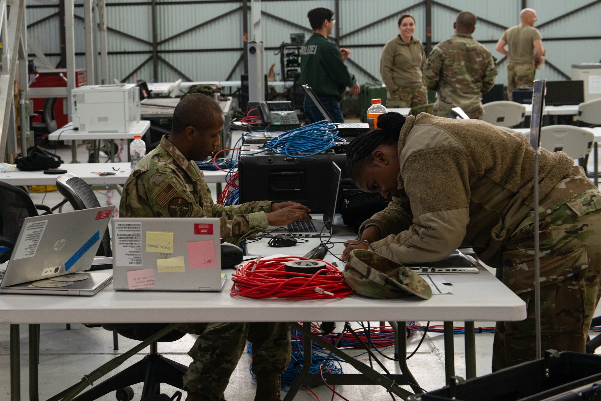 U.S. Air Force Airmen assigned to the 23rd Wing check in a laptop for the Wing Operations Center for use during the Mosaic Tiger 24-1 exercise Nov. 10, 2023, at Moody Air Force Base, Georgia. Communications Airmen set up a fully secure area for the WOC during the exercise from Nov. 13-17, requiring careful control and management of access for personnel and equipment. Mosaic Tiger 24-1 challenged communications Airmen to quickly set up, break down and move the WOC with minimal disruption to operations. (U.S. Air Force photo by Staff Sgt. John Crampton)