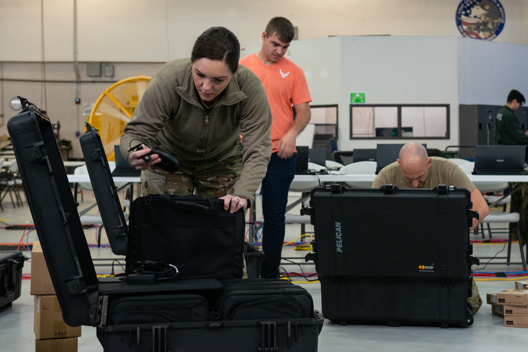 U.S. Air Force Airmen assigned to the 23rd Wing unload equipment while setting up a Wing Operations Center for use during the Mosaic Tiger 24-1 exercise Nov. 10, 2023, at Moody Air Force Base, Georgia. The WOC served as a command and control node that coordinated action between Moody; Grand Bay Bombing and Gunnery Range, Georgia; MacDill AFB, Florida; and Avon Park Air Force Range, Florida, during the exercise. Mosaic Tiger 24-1 challenged communications Airmen to quickly set up, break down and move the WOC with minimal disruption to operations. (U.S. Air Force photo by Staff Sgt. John Crampton)