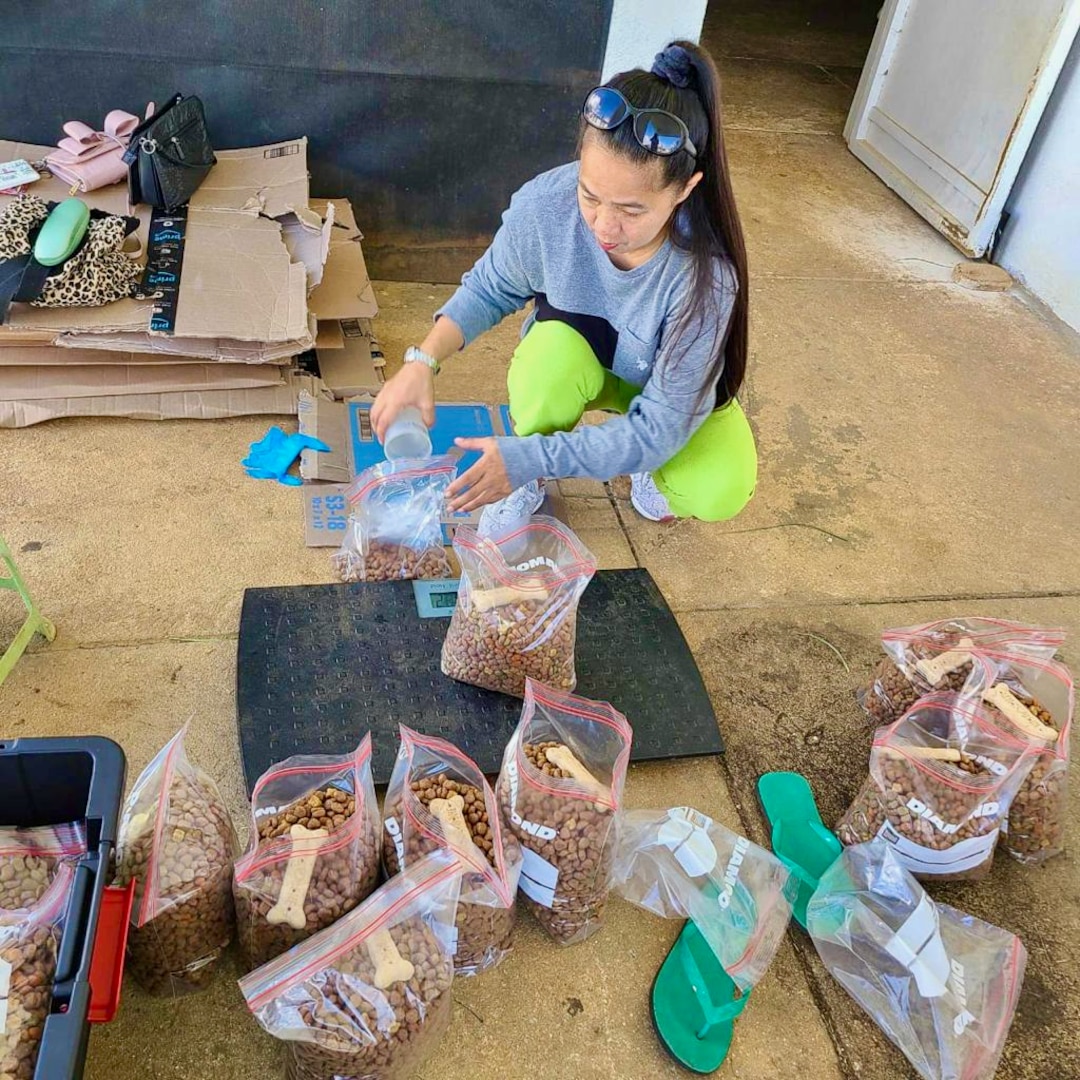 Saipan Humane Society members divvy dog food on Nov. 7, 2023, for a distribution event in Saipan, Commonwealth of the Northern Mariana Islands. The USCGC Myrtle Hazard (WPC 1139) crew delivered vital donations on their recent patrol. (Photo courtesy SHS)