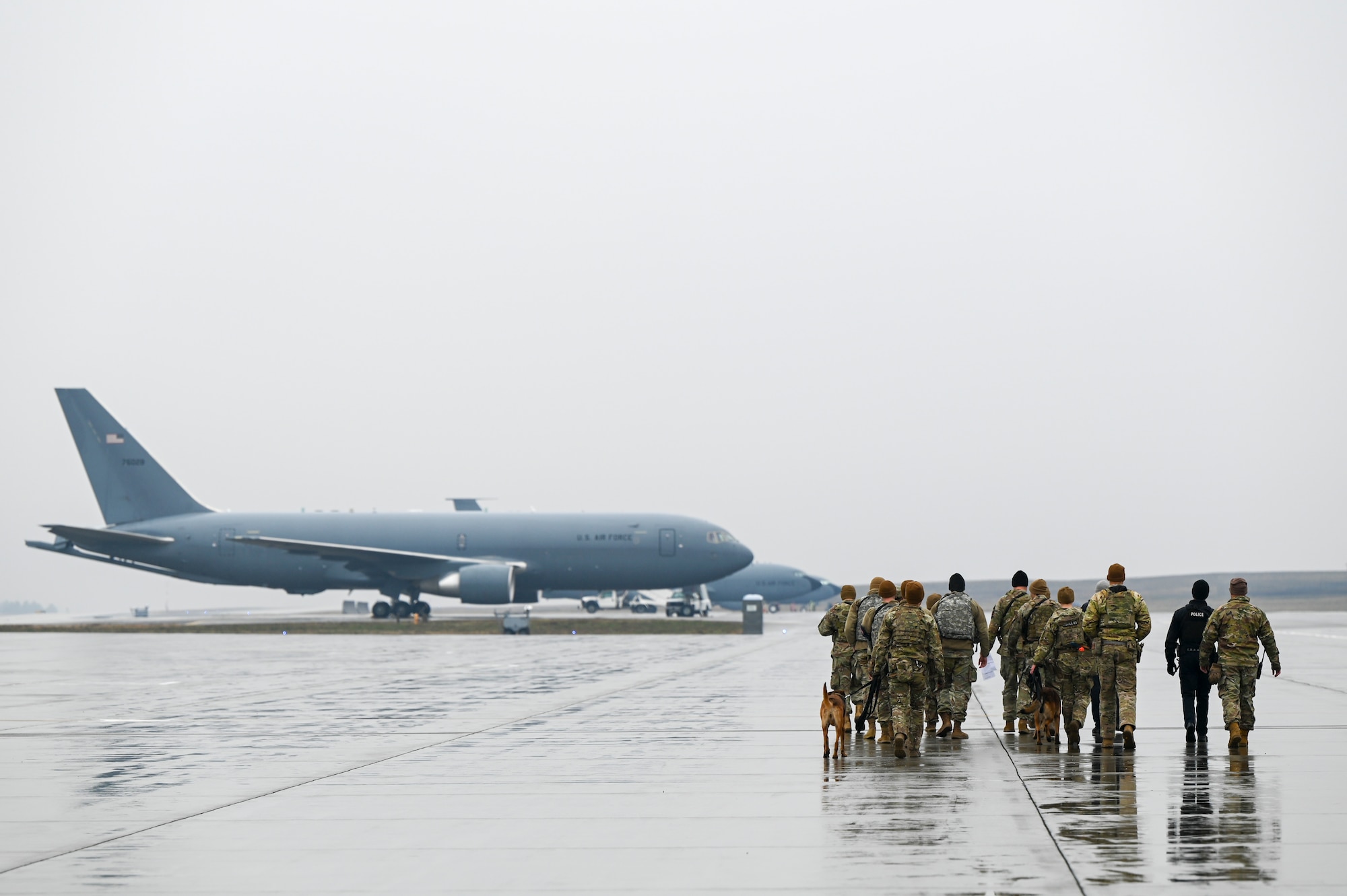 Airmen walk to KC-135