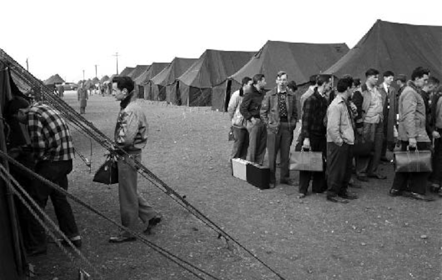 .Expansion for the Korean War placed great strains on the single point of entry for BMT, Lackland AFB.  To cope with its population explosion of over 75,000 new trainees and instructors, tent cities emerged—a long Air Force tradition.