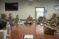 Photo of American and Polish Air Force members discussion.
