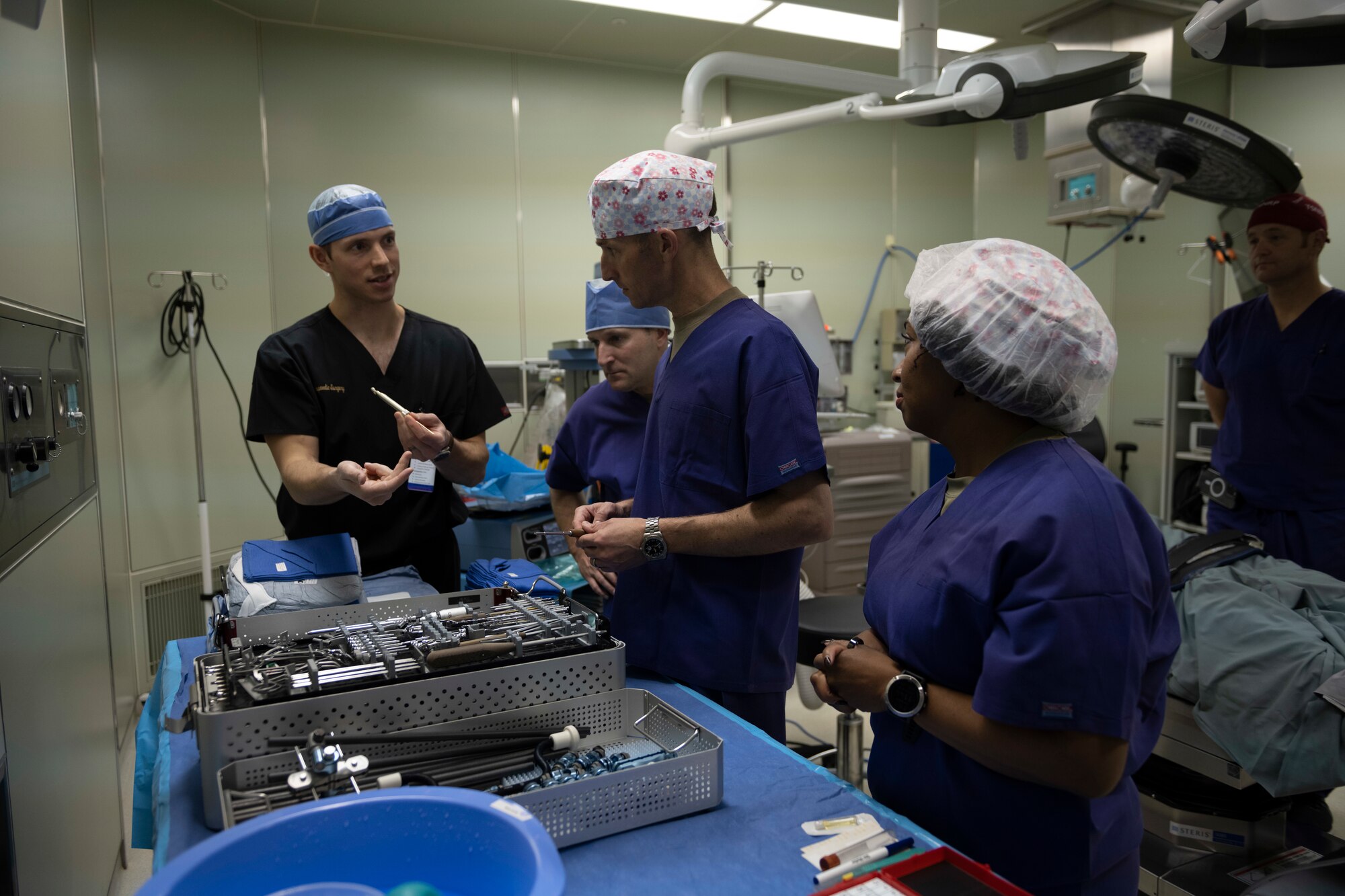 A surgeon showcases his tools during a tour