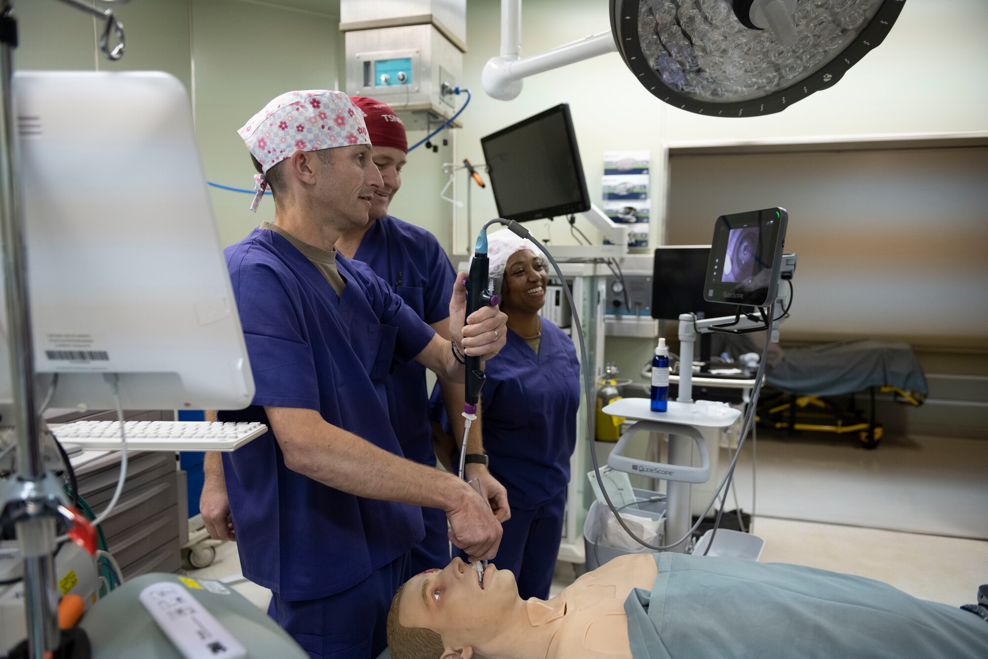 the commander moves a tube through a manikins esophagus