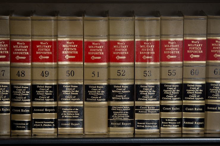 Close-up of legal books (bound copies of the United States Court of Appeals for the Armed Forces Court Rules) on a bookshelf. The Air Force Judge Advocate General's School is located at Maxwell Air Force Base and provides instruction to new judge advocates and paralegals, in addition to offering continuing legal education courses. The school also publishes scholarly legal journals semiannually and quarterly. (US Air Force Photo by Donna L. Burnett/Released)