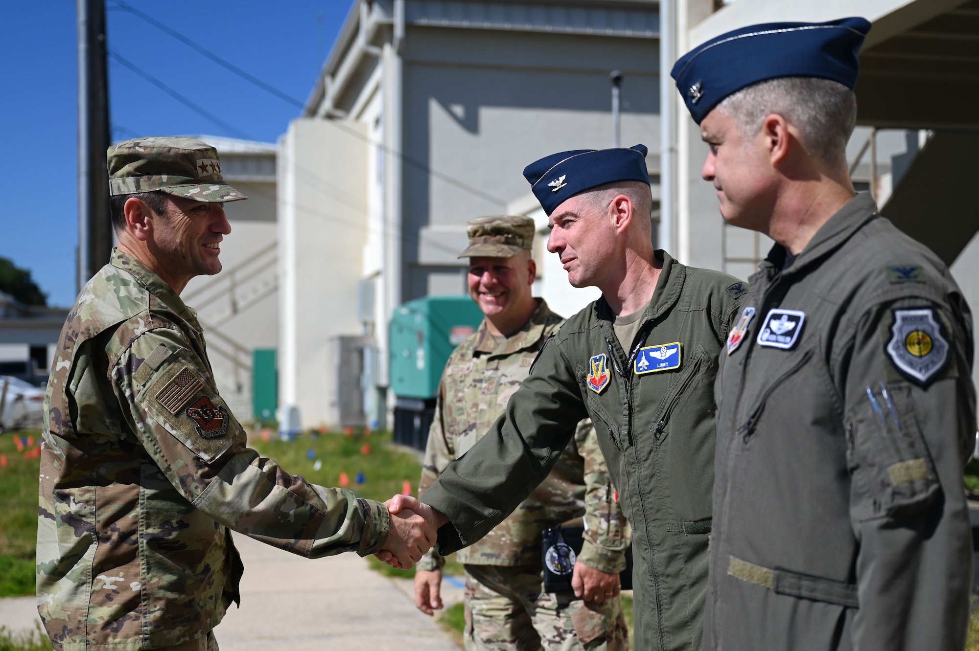 Lt. Gen. Kevin Kennedy, Commander, 16th Air Force (Air Forces Cyber), shakes hands with U.S. Air Force Col. John A. Christianson, 350th Spectrum Warfare Wing deputy commander, during a visit at Eglin Air Force Base, Fla., Nov. 3, 2023. The 350th SWW serves as the Air Force’s first Electromagnetic Spectrum (EMS) focused wing on enhancing air component commanders’ ability to synchronize, integrate and execute EMS capabilities across all domains and platforms. (U.S. Air Force photo by Staff Sgt. Ericka A. Woolever)