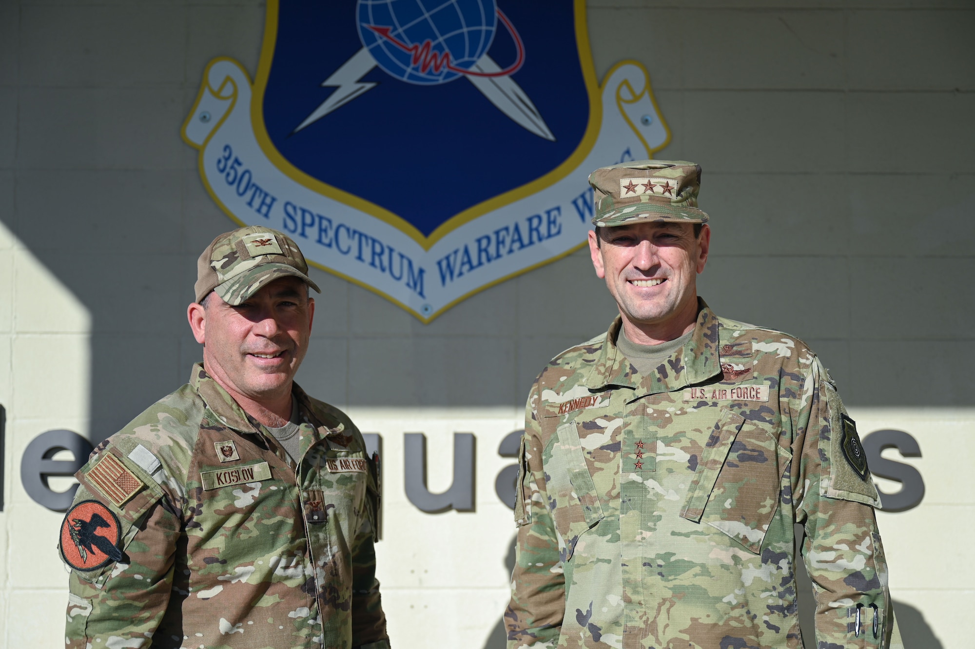 U.S. Air Force Col. Josh Koslov, 350th Spectrum Warfare Wing commander and Lt. Gen. Kevin Kennedy, Commander, 16th Air Force (Air Force Cyber), pose for a photo, at Eglin Air Force Base, Fla., Nov. 3, 2023. The 350th SWW mission is to develop and employ evolutionary, cutting-edge capabilities for warfighters that will make decisive impacts in battle, achieving commanders’ objectives and allowing warfighters to beat pacing competitors across the spectrum. (U.S. Air Force photo by Staff Sgt. Ericka A. Woolever)
