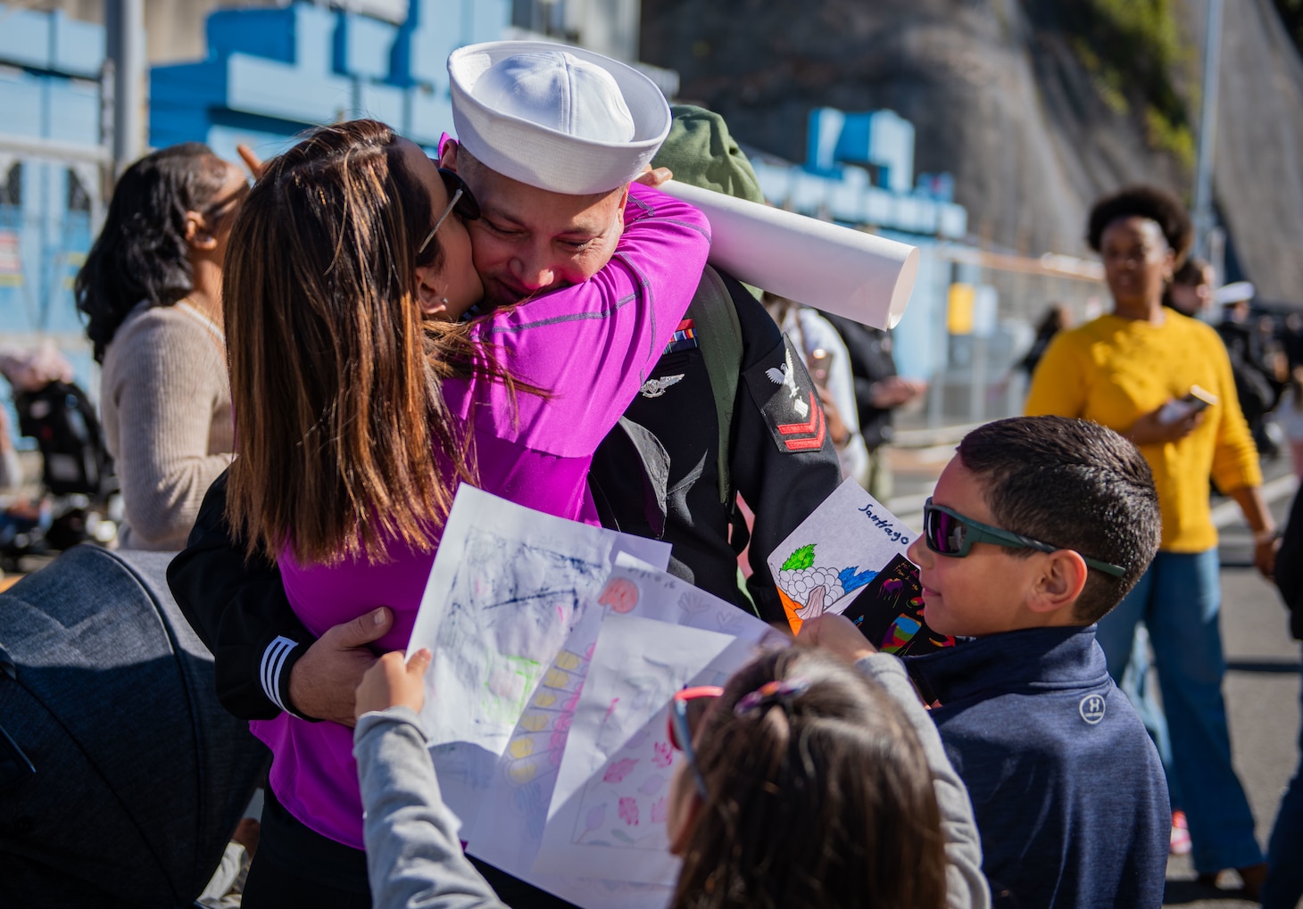 YOKOSUKA, Japan (Nov. 19, 2023) Personnel Specialist 2nd Class Otto Ycaza, from Houston, greets family members on the pier as the U.S. Navy’s only forward-deployed aircraft carrier, USS Ronald Reagan (CVN 76), returns to Commander, Fleet Activities Yokosuka, Japan, following a six-month deployment in the Indo-Pacific region, Nov. 19. During Ronald Reagan’s deployment, the ship conducted multinational exercises with the Japan Maritime Self-Defense Force (JMSDF), Royal Australian Navy, Indonesian Navy, and Republic of Korea Navy, a multi-large deck event with USS Carl Vinson (CVN 70), Carrier Strike Group 1, and JMSDF first-in-class helicopter destroyer JS Hyuga (DDH 181), and visited Vietnam, Republic of Korea, and the Philippines. Ronald Reagan, the flagship of Carrier Strike Group 5, provides a combat-ready force that protects and defends the United States, and supports alliances, partnerships and collective maritime interests in the Indo-Pacific region. (U.S. Navy photo by Mass Communication Specialist 2nd Class Caroline H. Lui)