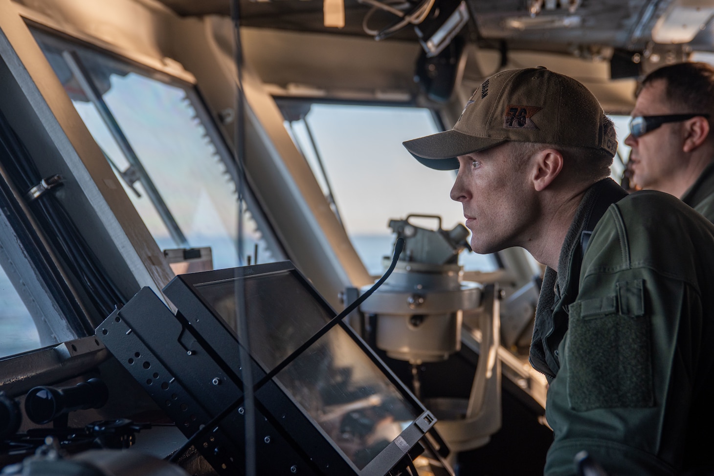 YOKOSUKA, Japan (Nov. 19, 2023) Lt. Colby Campbell from Dover, Pennsylvania, observes from the bridge as the U.S. Navy’s only forward-deployed aircraft carrier, USS Ronald Reagan (CVN 76), returns to Commander, Fleet Activities Yokosuka, Japan, following a six-month deployment in the Indo-Pacific region, Nov. 19. During Ronald Reagan’s deployment, the ship conducted multinational exercises with the Japan Maritime Self-Defense Force (JMSDF), Royal Australian Navy, Indonesian Navy, and Republic of Korea Navy, a multi-large deck event with USS Carl Vinson (CVN 70), Carrier Strike Group 1, and JMSDF first-in-class helicopter destroyer, JS Hyuga (DDH 181), and visited Vietnam, Republic of Korea, and the Philippines. Ronald Reagan, the flagship of Carrier Strike Group 5, provides a combat-ready force that protects and defends the United States, and supports alliances, partnerships and collective maritime interests in the Indo-Pacific region. (U.S. Navy photo by Mass Communication Specialist 3rd Class Jordan Brown)