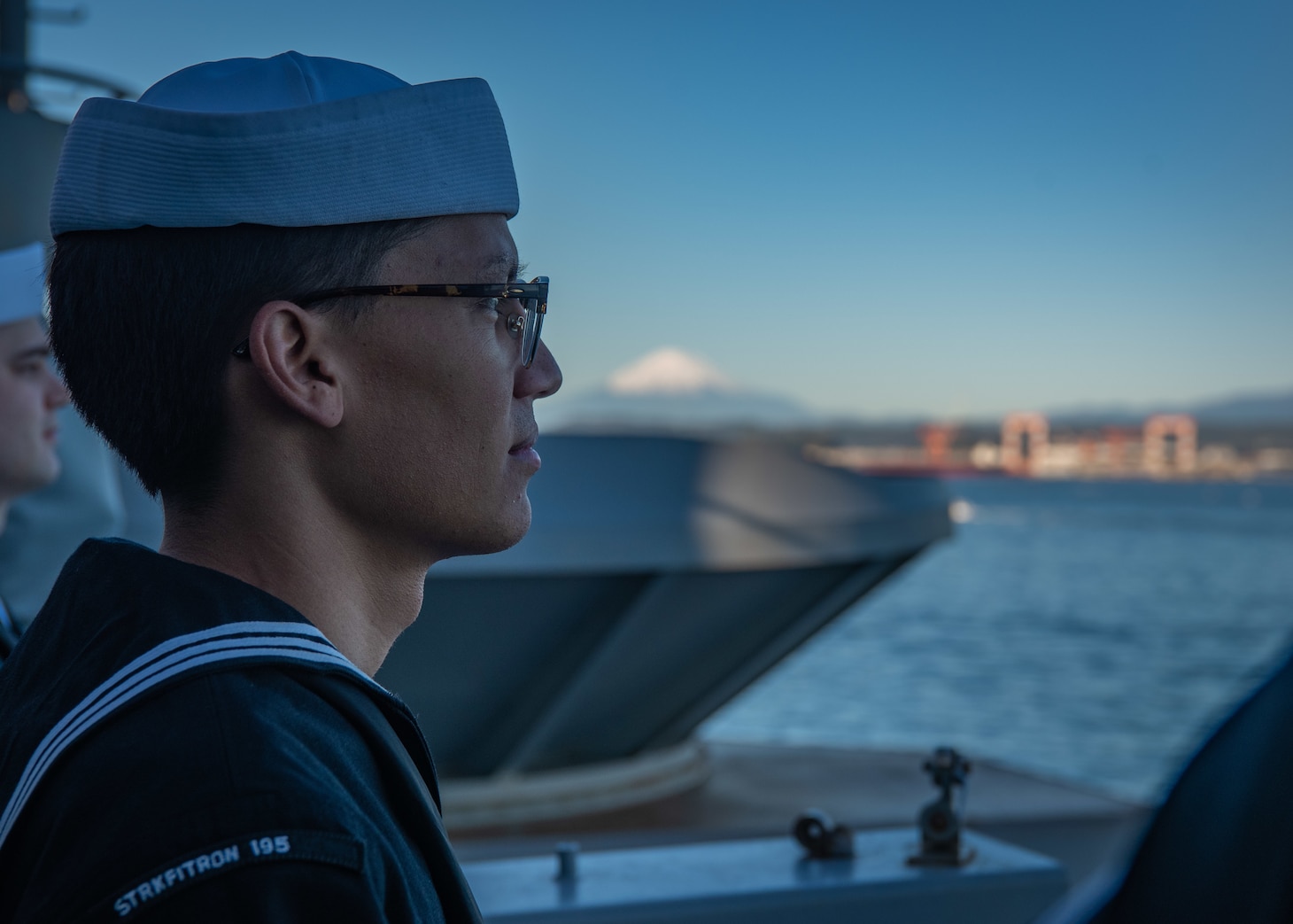 YOKOSUKA, Japan (Nov. 19, 2023) Aviation Electronics Technician Airman Brandonn Catabay, from Portland, Oregon, mans the rails on vulture’s row as the U.S. Navy’s only forward-deployed aircraft carrier, USS Ronald Reagan (CVN 76), returns to Commander, Fleet Activities Yokosuka, Japan, following a six-month deployment in the Indo-Pacific region, Nov. 19. During Ronald Reagan’s deployment, the ship conducted multinational exercises with the Japan Maritime Self-Defense Force (JMSDF), Royal Australian Navy, Indonesian Navy, and Republic of Korea Navy, a multi-large deck event with USS Carl Vinson (CVN 70), Carrier Strike Group 1, and JMSDF first-in-class helicopter destroyer, JS Hyuga (DDH 181), and visited Vietnam, Republic of Korea, and the Philippines. Ronald Reagan, the flagship of Carrier Strike Group 5, provides a combat-ready force that protects and defends the United States, and supports alliances, partnerships and collective maritime interests in the Indo-Pacific region. (U.S. Navy photo by Mass Communication Specialist 3rd Class Jordan Brown)