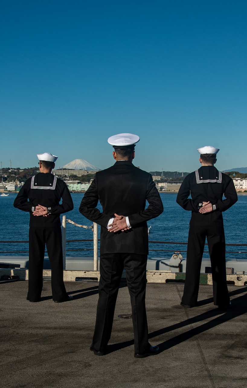 YOKOSUKA, Japan (Nov. 19, 2023) Sailors man the rails on the flight deck as the U.S. Navy’s only forward-deployed aircraft carrier, USS Ronald Reagan (CVN 76), returns to Commander, Fleet Activities Yokosuka, Japan, following a six-month deployment in the Indo-Pacific region, Nov. 19. During Ronald Reagan’s deployment, the ship conducted multinational exercises with the Japan Maritime Self-Defense Force (JMSDF), Royal Australian Navy, Indonesian Navy, and Republic of Korea Navy, a multi-large deck event with USS Carl Vinson (CVN 70), Carrier Strike Group 1, and JMSDF first-in-class helicopter destroyer, JS Hyuga (DDH 181), and visited Vietnam, Republic of Korea, and the Philippines. Ronald Reagan, the flagship of Carrier Strike Group 5, provides a combat-ready force that protects and defends the United States, and supports alliances, partnerships and collective maritime interests in the Indo-Pacific region. (U.S. Navy photo by Mass Communication Specialist 3rd Class Heather McGee)