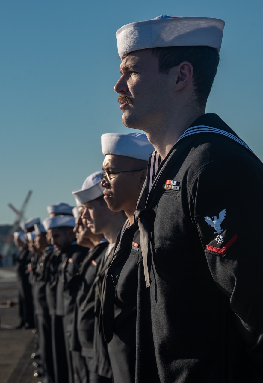 YOKOSUKA, Japan (Nov. 19, 2023) Sailors man the rails on the flight deck as the U.S. Navy’s only forward-deployed aircraft carrier, USS Ronald Reagan (CVN 76), returns to Commander, Fleet Activities Yokosuka, Japan, following a six-month deployment in the Indo-Pacific region, Nov. 19. During Ronald Reagan’s deployment, the ship conducted multinational exercises with the Japan Maritime Self-Defense Force (JMSDF), Royal Australian Navy, Indonesian Navy, and Republic of Korea Navy, a multi-large deck event with USS Carl Vinson (CVN 70), Carrier Strike Group 1, and JMSDF first-in-class helicopter destroyer, JS Hyuga (DDH 181), and visited Vietnam, Republic of Korea, and the Philippines. Ronald Reagan, the flagship of Carrier Strike Group 5, provides a combat-ready force that protects and defends the United States, and supports alliances, partnerships and collective maritime interests in the Indo-Pacific region. (U.S. Navy photo by Mass Communication Specialist 3rd Class Heather McGee)