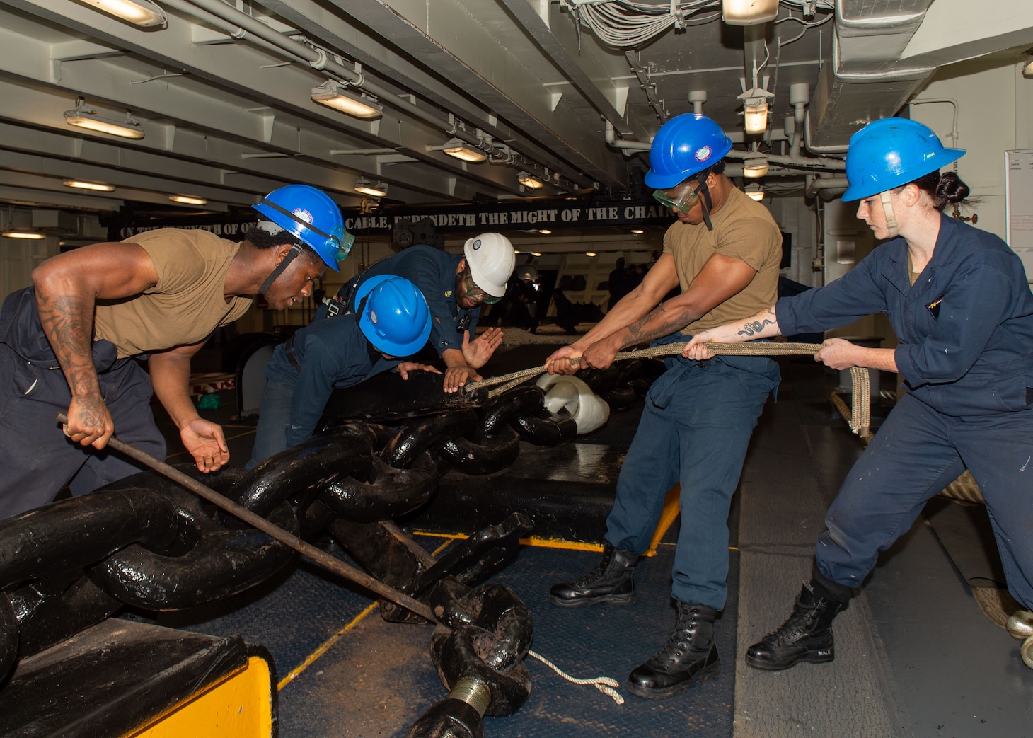 YOKOSUKA, Japan (Nov. 19, 2023) Sailors attach a pelican hook to the anchor chain in the forecastle as the U.S. Navy’s only forward-deployed aircraft carrier, USS Ronald Reagan (CVN 76), returns to Commander, Fleet Activities Yokosuka, Japan, following a six-month deployment in the Indo-Pacific region, Nov. 19. During Ronald Reagan’s deployment, the ship conducted multinational exercises with the Japan Maritime Self-Defense Force (JMSDF), Royal Australian Navy, Indonesian Navy, and Republic of Korea Navy, a multi-large deck event with USS Carl Vinson (CVN 70), Carrier Strike Group 1, and JMSDF first-in-class helicopter destroyer JS Hyuga (DDH 181), and visited Vietnam, Republic of Korea, and the Philippines. Ronald Reagan, the flagship of Carrier Strike Group 5, provides a combat-ready force that protects and defends the United States, and supports alliances, partnerships and collective maritime interests in the Indo-Pacific region. (U.S. Navy photo by Mass Communication Specialist Seaman Kyree Rogers)