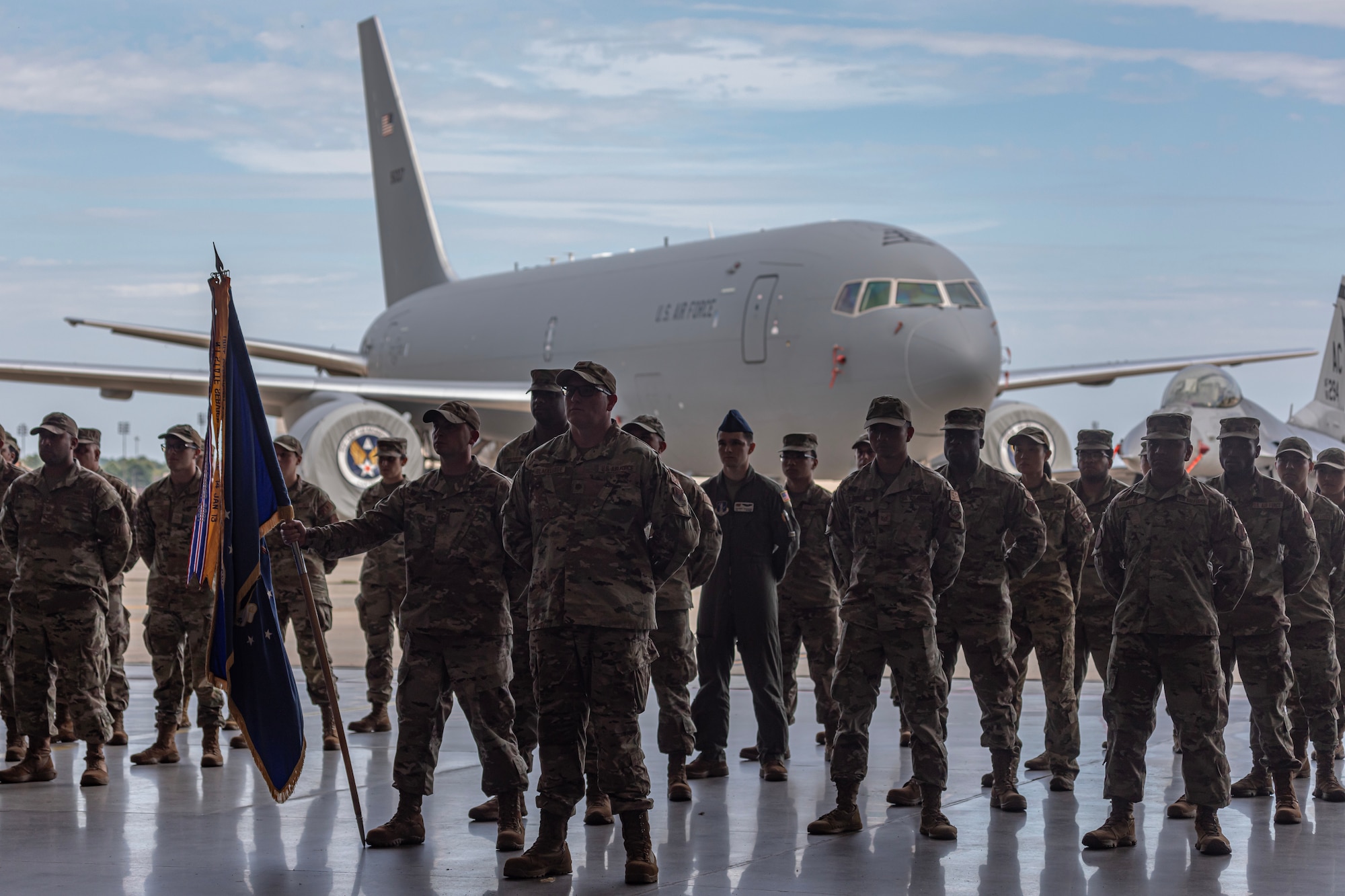U.S. Air Force Airmen with the New Jersey Air National Guard stand in formation in front of a KC-46 Pegasus during a change of command ceremony on Joint Base McGuire-Dix-Lakehurst, N.J., Sept. 17, 2023.