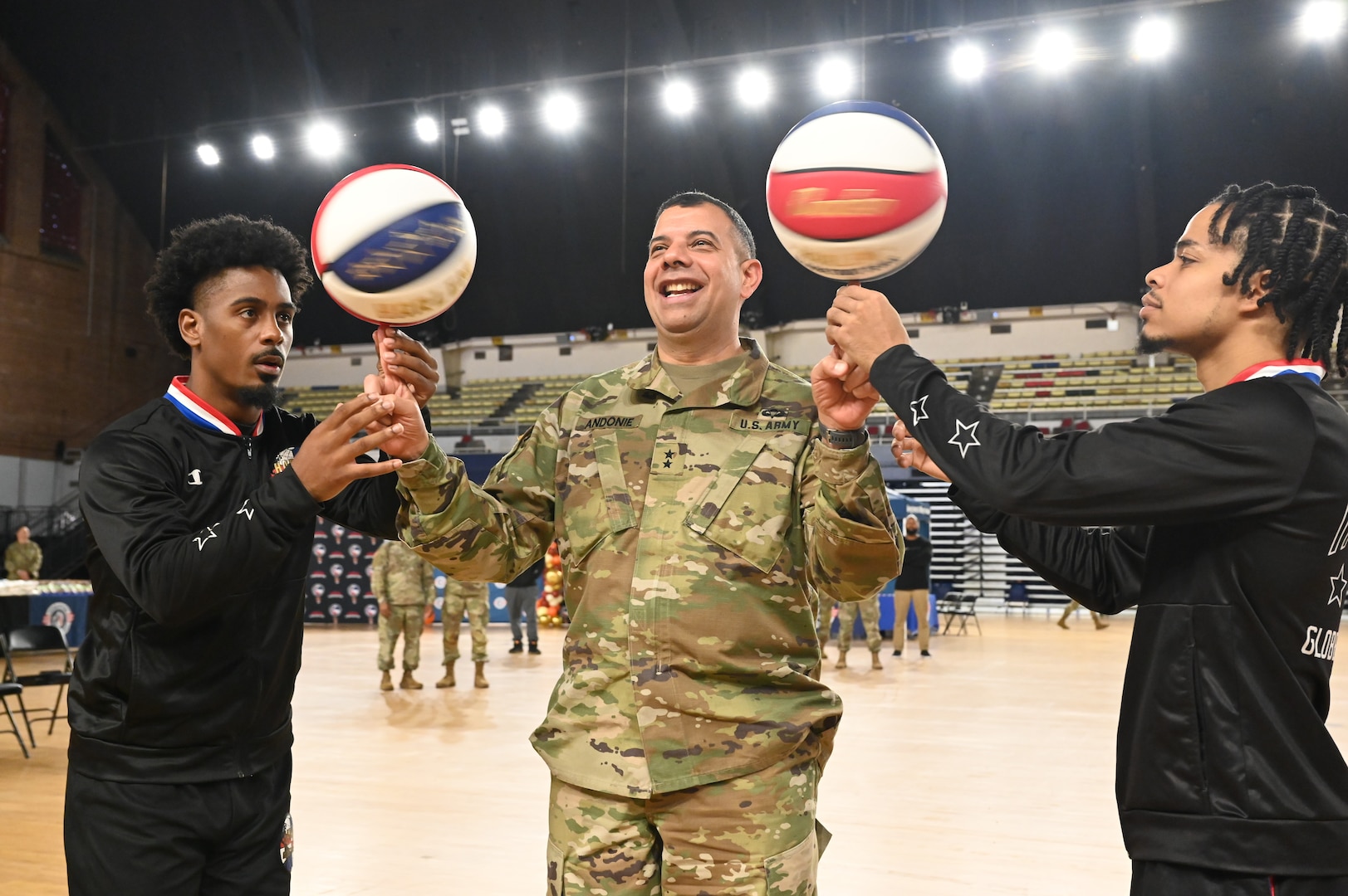 Harlem Globetrotters "Too Tall” Winston and "Wham” Middleton thank District of Columbia National Guard members, while also participating in a holiday meal distribution during a Operation Homefront ‘Holiday Meals for Military’ event at the D.C. Armory on Nov. 17, 2023. Operation Homefront provides programs designed to build strong, stable, and secure military families. (U.S. Air National Guard photo by MSgt Arthur M. Wright)