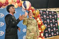 Harlem Globetrotters "Too Tall” Winston and "Wham” Middleton thank District of Columbia National Guard members, while also participating in a holiday meal distribution during a Operation Homefront ‘Holiday Meals for Military’ event at the D.C. Armory on Nov. 17, 2023. Operation Homefront provides programs designed to build strong, stable, and secure military families. (U.S. Air National Guard photo by MSgt Arthur M. Wright)