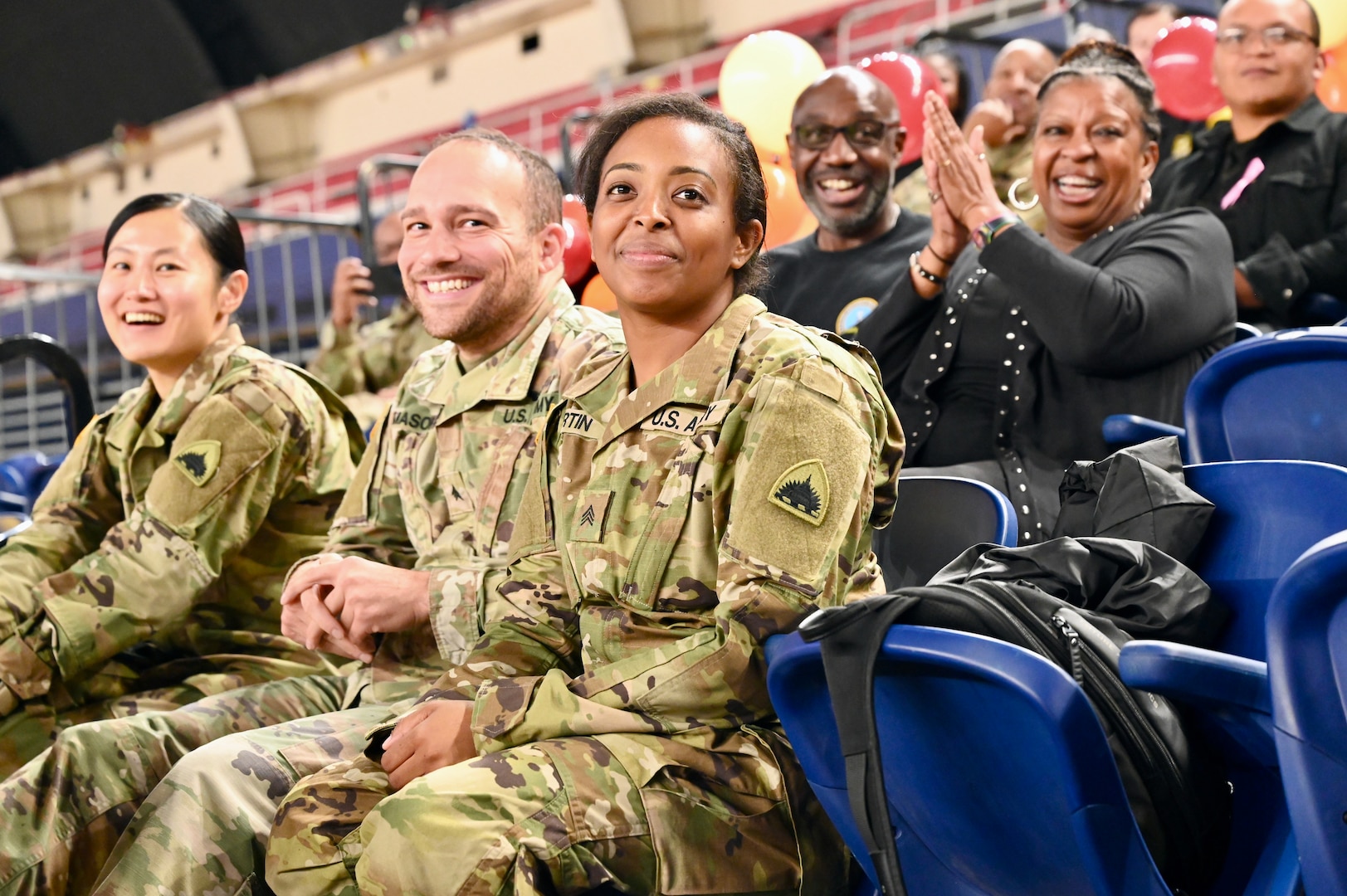 Harlem Globetrotters "Too Tall” Winston and "Wham” Middleton thank District of Columbia National Guard members, while also participating in a holiday meal distribution during a Operation Homefront ‘Holiday Meals for Military’ event at the D.C. Armory on Nov. 17, 2023. Operation Homefront provides programs designed to build strong, stable, and secure military families. (U.S. Air National Guard photo by MSgt Arthur M. Wright)