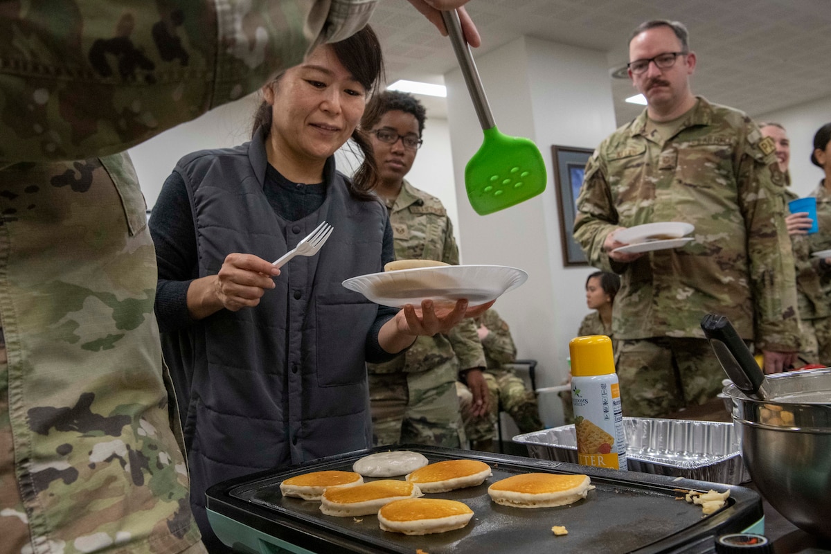 A Japanese national waits in line for a pancake.