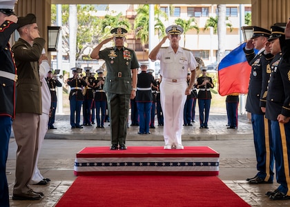 Adm. John C. Aquilino, right, commander, U.S. Indo-Pacific Command, stands alongside Gen. Romeo Brawner, Jr., Armed Forces of the Philippines Chief of Staff, during an honors ceremony at USINDOPACOM headquarters, Camp H.M. Smith in Honolulu, Nov. 17, 2023. The visit included exchanges on regional security and mutual partnership, further developing the strong democratic, economic and strategic partnership with the Philippines codified in the 1951 U.S.-Philippines Mutual Defense Treaty. USINDOPACOM is committed to enhancing stability in the Indo-Pacific region by promoting security cooperation, encouraging peaceful development, responding to contingencies, deterring aggression and, when necessary, fighting to win. (U.S. Navy photo by Mass Communication Specialist 1st Class John Bellino)