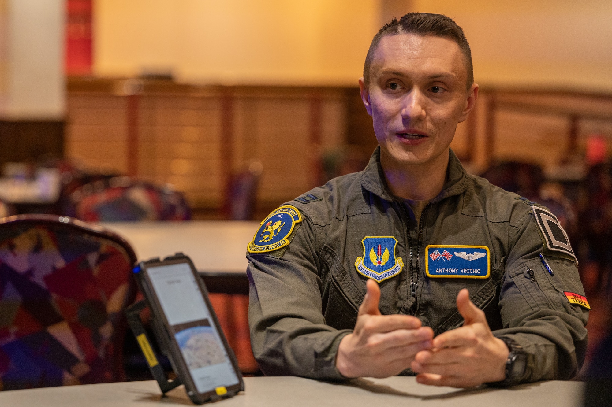 U.S. Air Force Capt. Anthony Vecchio, 100th Operations Support Squadron KC-135 Stratotanker pilot, briefs the ongoing upgrades being utilized on the KC-135 during the European Tanker Symposium at Royal Air Force Mildenhall, England, Nov. 16, 2023.