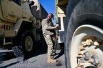 Dozens of wheeled vehicle mechanics (91B) keep tactical vehicles operational at the District of Columbia National Guard’s Combined Support Maintenance Shop at Joint Base Anacostia-Bolling (JBAB), Oct. 21, 2023. Four maintenance shops ensure mechanics are technically sound in maintenance and recovery to fulfill mission requirements. Vehicles include Medium Tactical Vehicles (MTV), Light Medium Tactical Vehicles (LMTV), High Mobility Multipurpose Wheeled Vehicles (HMMWV), and Mine Resistant Ambush Protected All-Terrain Vehicles (M-ATV). (U.S. Air National Guard photo by Master Sgt. Arthur Wright)