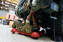 Dozens of wheeled vehicle mechanics (91B) keep tactical vehicles operational at the District of Columbia National Guard’s Combined Support Maintenance Shop at Joint Base Anacostia-Bolling (JBAB), Oct. 21, 2023. Four maintenance shops ensure mechanics are technically sound in maintenance and recovery to fulfill mission requirements. Vehicles include Medium Tactical Vehicles (MTV), Light Medium Tactical Vehicles (LMTV), High Mobility Multipurpose Wheeled Vehicles (HMMWV), and Mine Resistant Ambush Protected All-Terrain Vehicles (M-ATV). (U.S. Air National Guard photo by Master Sgt. Arthur Wright)