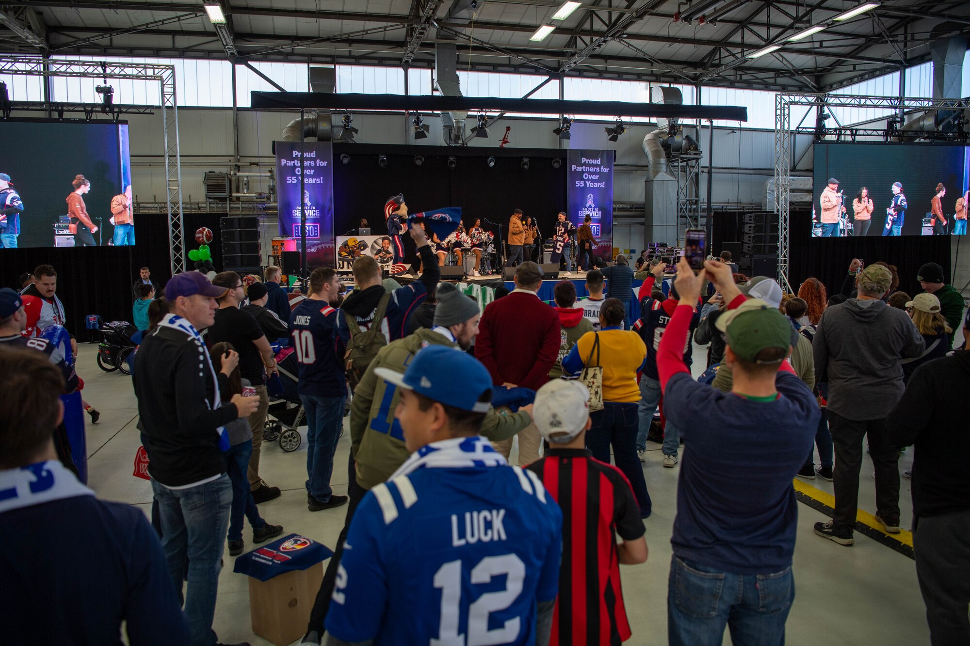 U.S. Air Force Airmen from the 86th Security Forces Squadron, and Kaiserslautern Military Community members dance during a tailgate event at Ramstein Air Base, Germany, Nov. 11, 2023.