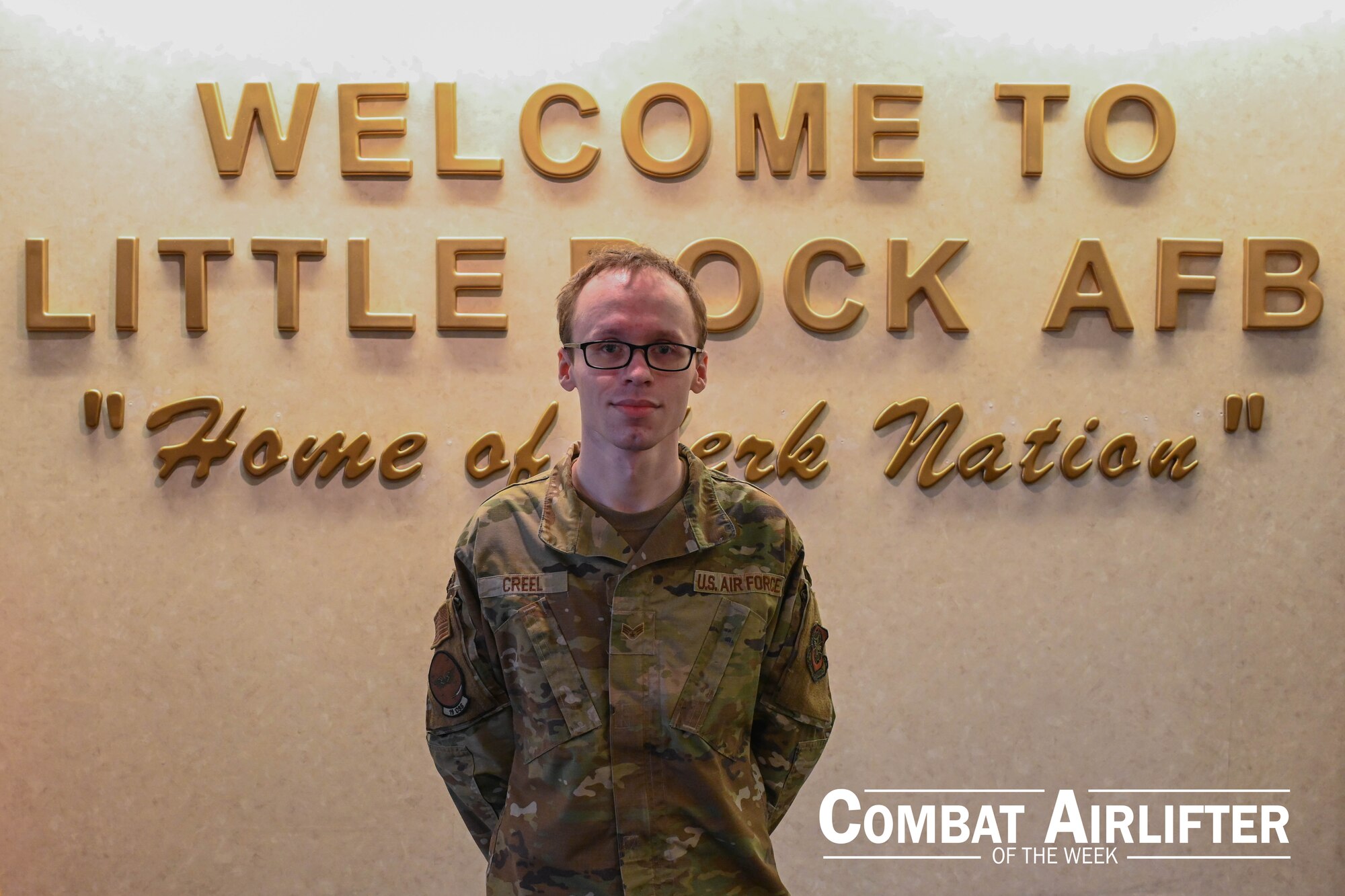 A man in uniform poses for a photo