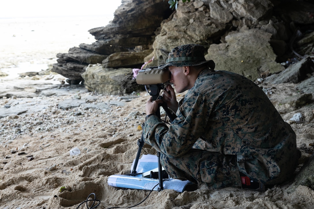 U.S. Marine Corps Cpl. Hunter Way, a fire support Marine with Marine Rotational Force-Southeast Asia, I Marine Expeditionary Force, watches for notional vessels of interest at a shore-based maritime sensing site for a simulated close air support activity during MRF-SEA 23, in Sorsogon, Luzon, Philippines, Oct. 9, 2023. Sensing sites such as this one advance maritime domain awareness and improve lethality of the joint force. MRF-SEA is a Marine Corps Forces Pacific operational model which involves planned exchanges with subject matter experts, promotes security goals with Allies and partners, and positions I MEF forces west of the International Date Line.