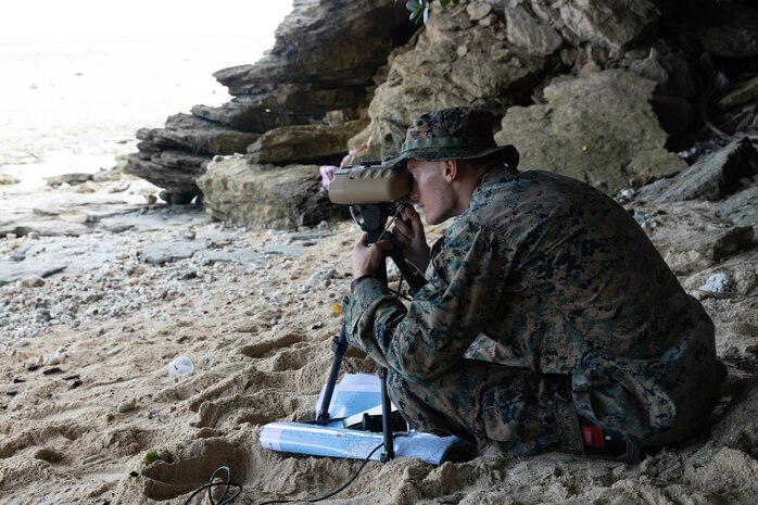 U.S. Marine Corps Cpl. Hunter Way, a fire support Marine with Marine Rotational Force-Southeast Asia, I Marine Expeditionary Force, watches for notional vessels of interest at a shore-based maritime sensing site for a simulated close air support activity during MRF-SEA 23, in Sorsogon, Luzon, Philippines, Oct. 9, 2023. Sensing sites such as this one advance maritime domain awareness and improve lethality of the joint force. MRF-SEA is a Marine Corps Forces Pacific operational model which involves planned exchanges with subject matter experts, promotes security goals with Allies and partners, and positions I MEF forces west of the International Date Line.