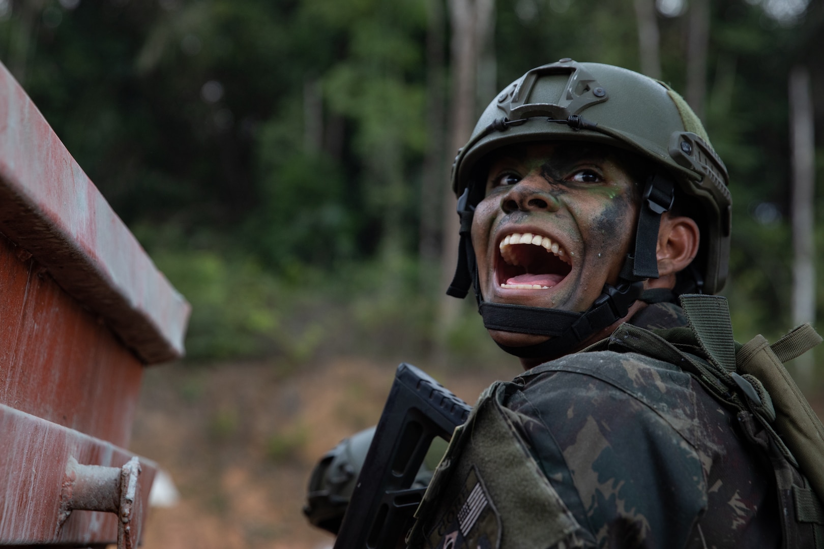 A Brazilian Soldiers calls out to his teammates during the final assault of Exercise Southern Vanguard 24.