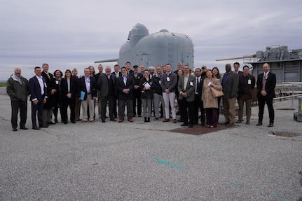 IMAGE: A large group of distinguished guests who attended the Dahlgren Proving Ground Advanced Capability Demonstration Event Oct. 31 at Naval Surface Warfare Center Dahlgren Division stand for a photo at the Potomac River Test Range.