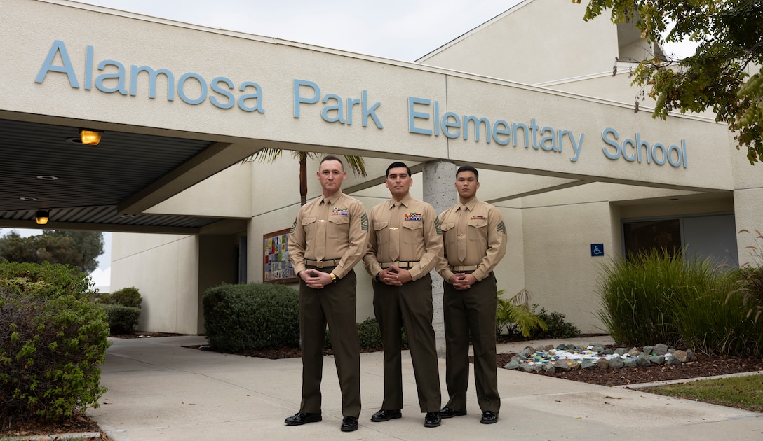 U.S. Marines with Meteorology and Oceanography section of 1st Intelligence Battalion, I Marine Expeditionary Force Information Group, pose for a photo at Alamosa Elementary School, Oceanside, California, Nov. 15, 2023. The Marines with the battalion spent time with the local school to bolster their relationship with the local community and share their knowledge. (U.S. Marine Corps photo by Lance Cpl. Ricardo Ramirez)